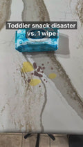 Toddler snack spill on the kitchen counter cleaned with one Stork & Sun wipe