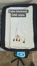 Fake blowout test on a changing pad: one Stork & Sun wipe cleans it up